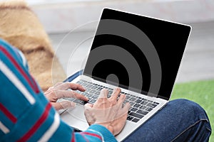 30s handsome businessman  searching and reading article from internet.  Modern arab businessman in casual clothes working at home