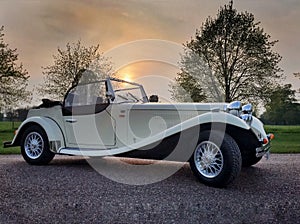 30s style roadster at sunset