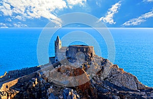 31.03.2019. San Pietro church with sea horizon in background, Lord Byron Natural park in Portovenere village on stone cliff rock a