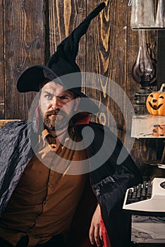 31 october. Make up and scary concept for man. Celebration party. Funny wise wizard on a Halloween background. Wizard