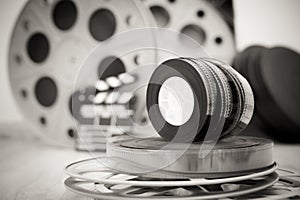 35 mm movie reels with clapper and boxes in background