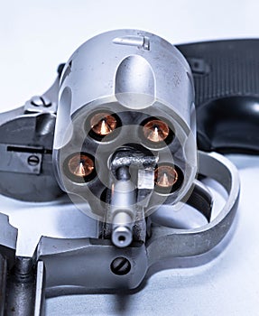 A 357 magnum revolver with its cylinder open and loaded with hollow point bullets