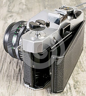 35mm analog film camera with open film compartment