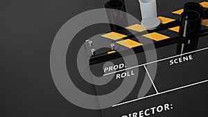 35mm color print film and Clapper board or movie slate on black background. It use in movie and video production industry