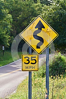 35mph crooked road sign