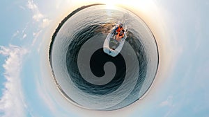 360-degree reverse panorama of two men sailing in a boat