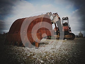 360 digger in a field rusty 3