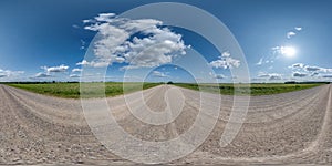 360 hdri panorama on gravel road with clouds and sun on blue sky in equirectangular spherical seamless projection, use as sky