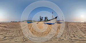 360 hdri panorama near old fishing boats in sand on ocean or sea at sunset in equirectangular spherical seamless projection