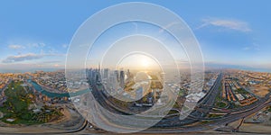 360 panorama by 180 degrees angle seamless panorama of aerial view of Dubai Downtown skyline and highway, United Arab Emirates or