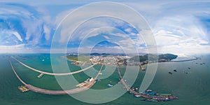 360 panorama by 180 degrees angle seamless panorama of aerial view of pier with boats with container cargo ship in the export and