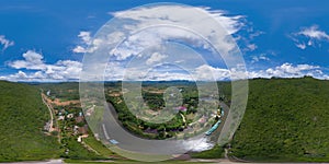 360 panorama by 180 degrees angle seamless panorama of green mountain hill with lake or river. Nature landscape background in