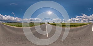 360 seamless hdri panorama view on asphalt road among fields in summer day with awesome clouds in blue sky in equirectangular