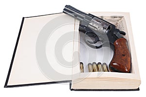 .38 caliber revolver gun with cartridges hidden in a book