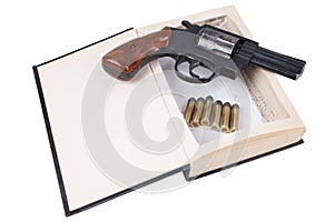 .38 caliber revolver gun with cartridges hidden in a book