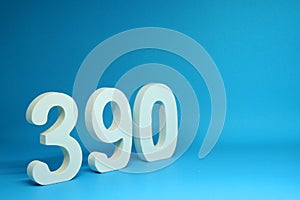 390  three hundred and ninety  word Isolated Blue Background with Copy Space - Number 390% Percentage or Promotion - Discount or