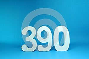 390  three hundred and ninety  word Isolated Blue Background with Copy Space - Number 390% Percentage or Promotion - Discount or