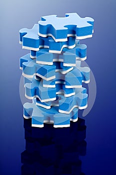3D blue puzzle on blue background.
