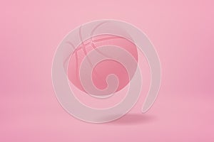 3d close-up rendering of light pink basketball bouncing on light pink background.