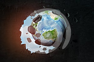 3d close-up rendering of planet Earth punching big hole in black wall with blue sky peeking though hole.