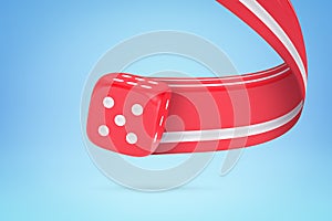 3d close-up rendering of red dice with white dots leaving pixel stretch trail behind it on light blue background.