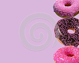 3D donuts on a purple background is a realistic sweet dessert with a top. 3D rendering