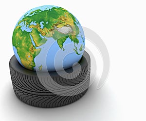 3d earth globe in a car tire on white