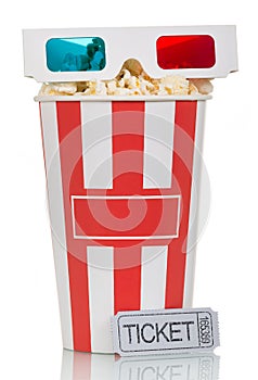 3D glasses and box filled with popcorn, movie ticket on white.