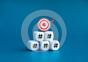 3d goal target icon on top of white cube block stack pyramid shape with hashtag icon symbol blocks.