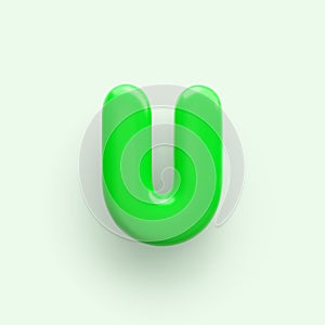 3D Green letter U with a glossy surface on a light background .