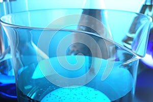 3d illustration of a chemical reaction, the concept of a scientific laboratory on a blue background. Flasks filled with
