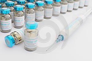 3d illustration. Covid19 vaccines inside bottles on light base abstract background