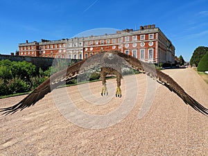 3D illustration of an eagle and Hampton Court Palace