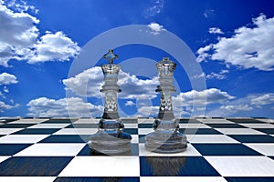 3D illustration two glass chess pieces against a blue sky