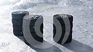 3d illustration Winter tires on a with falling snow background of snow storm, snowfall and slippery winter road. Winter