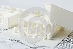 3D model of the decomposed house parts floor and roof printed on a 3D printer with white filament by FDM technology for