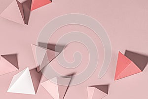 3D pink pyramid paper craft on a pink background