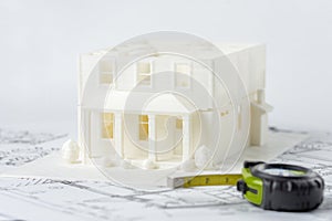3D plastic model of the family house without roof printed on a 3D printer with white filament by FDM technology for