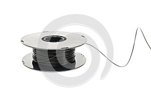 3D Printer Plastic Filament. Spool of black thermoplastic wire for 3D printing close up