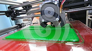 3D printer. working 3d printer. 3d printer printing object molten plastic.