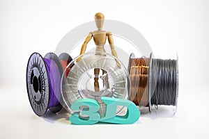 3D printing filament reels with wooden anthropomorphic doll with text `3d` on white background