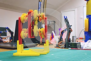 3D printing gears walking mechanism. 3d printed plastic Robot