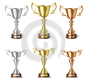 3d realistic winner cup or trophy for victory ceremony. Isolated golden, silver and bronze goblet