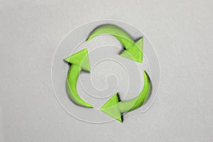 3d recycling-Symbol made with plasticine. Sustainability concept on grey background. Green earth recycle concept