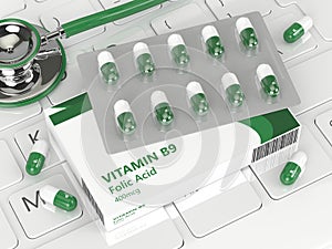 3d render of B9 folic acid pills lying on keyboard