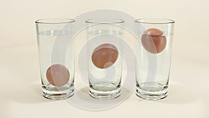 3D render of Egg in water test on transparent glass, Egg freshness test on white background, Bad egg floats in water