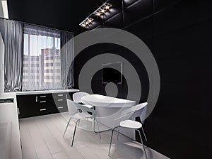 3d render of a modern kitchen in an city apartment. Kitchen interior design with black cabinets below and white cabinets