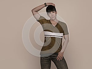 3D Render : Portrait of a smiling young handsome asian man in brown T-shirt and jeans