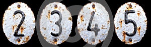 3D render set of numbers 2, 3, 4, 5 made of forged metal on the background fragment of a metal surface with cracked rust