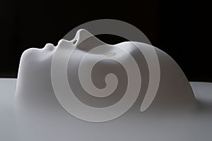 3D render of a white surface in the shape of a human mask